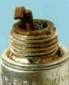 Spark plug with mechanical damage